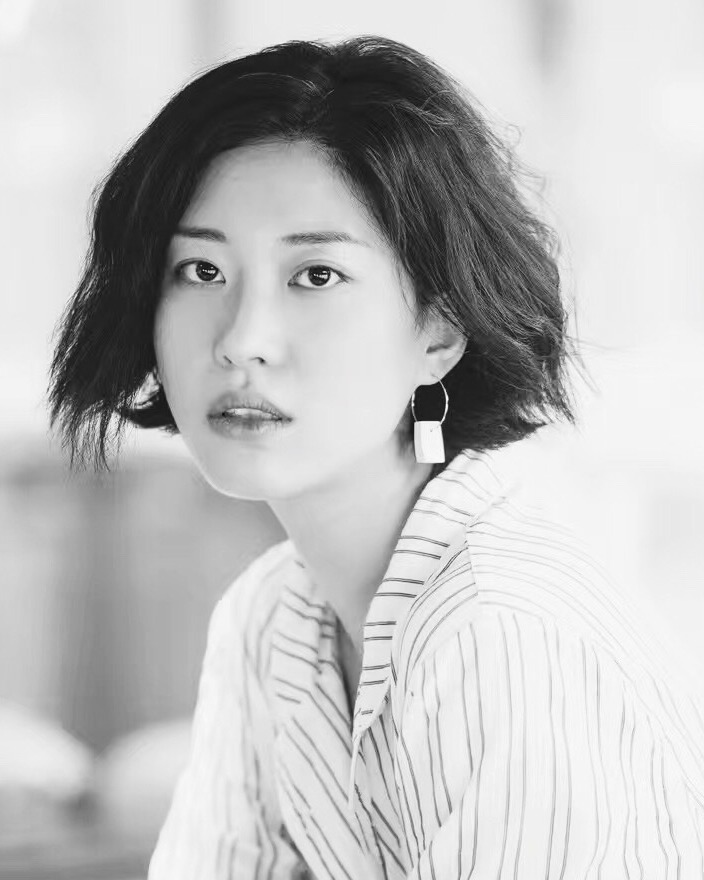 Official black-and-white portrait of Quentina Yuan