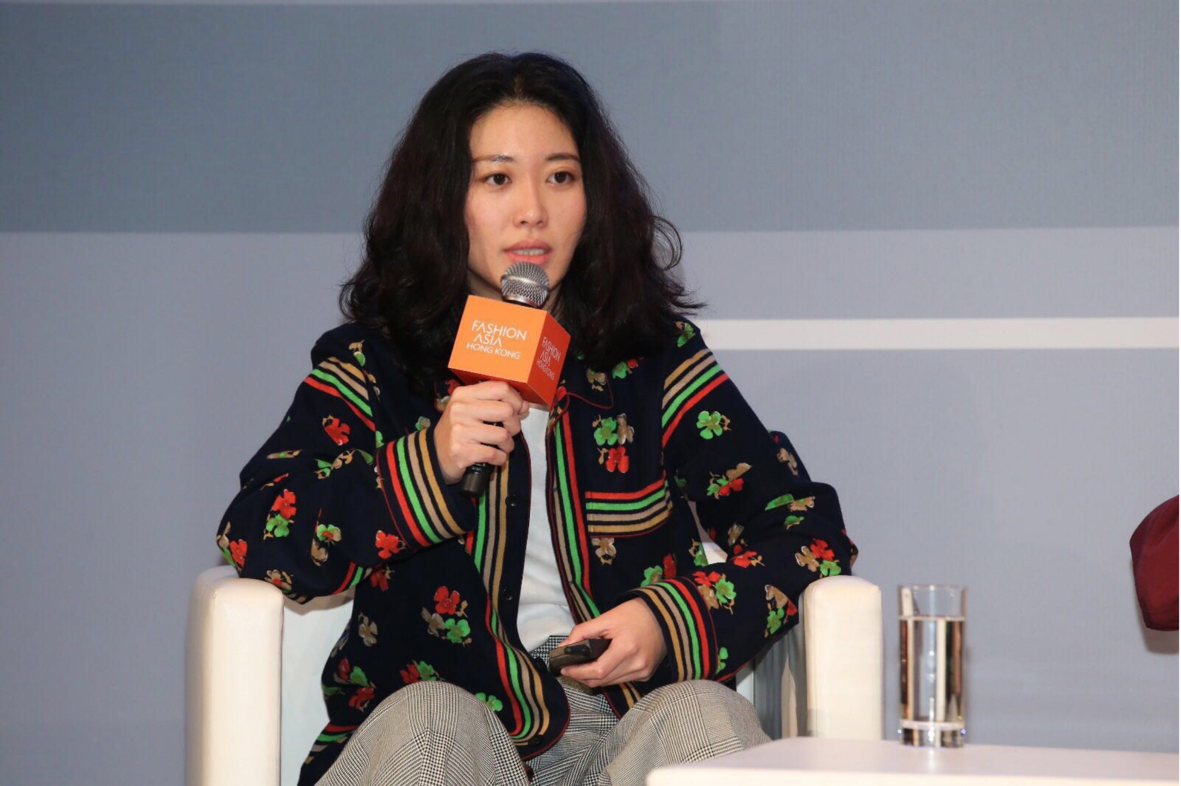 Quentina Yuan speaking on stage at Fashion Asia Hong Kong